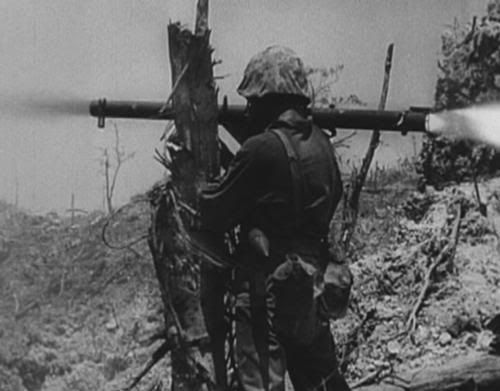 world war II bazooka photo: Marine fires Bazooka on Peleliu Peleliu-MarinefiresaBazookaM1A1Launcher.jpg