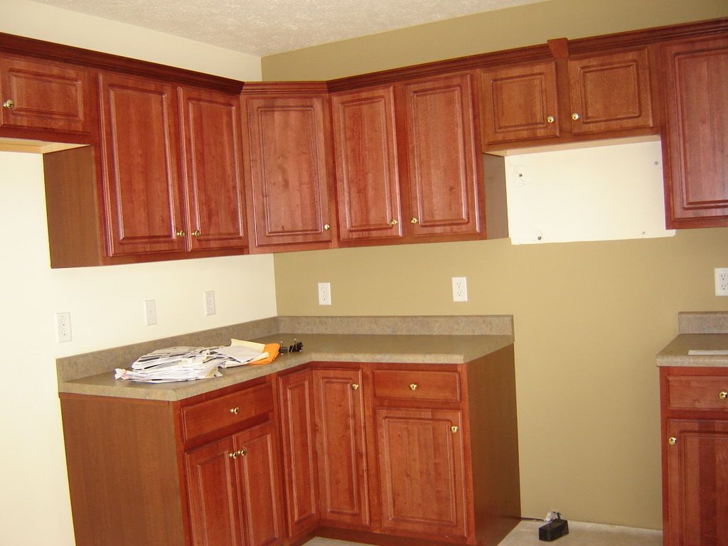 Kitchen Sink Cabinets Cherry Cabinets With Glass Tile Backsplash title=